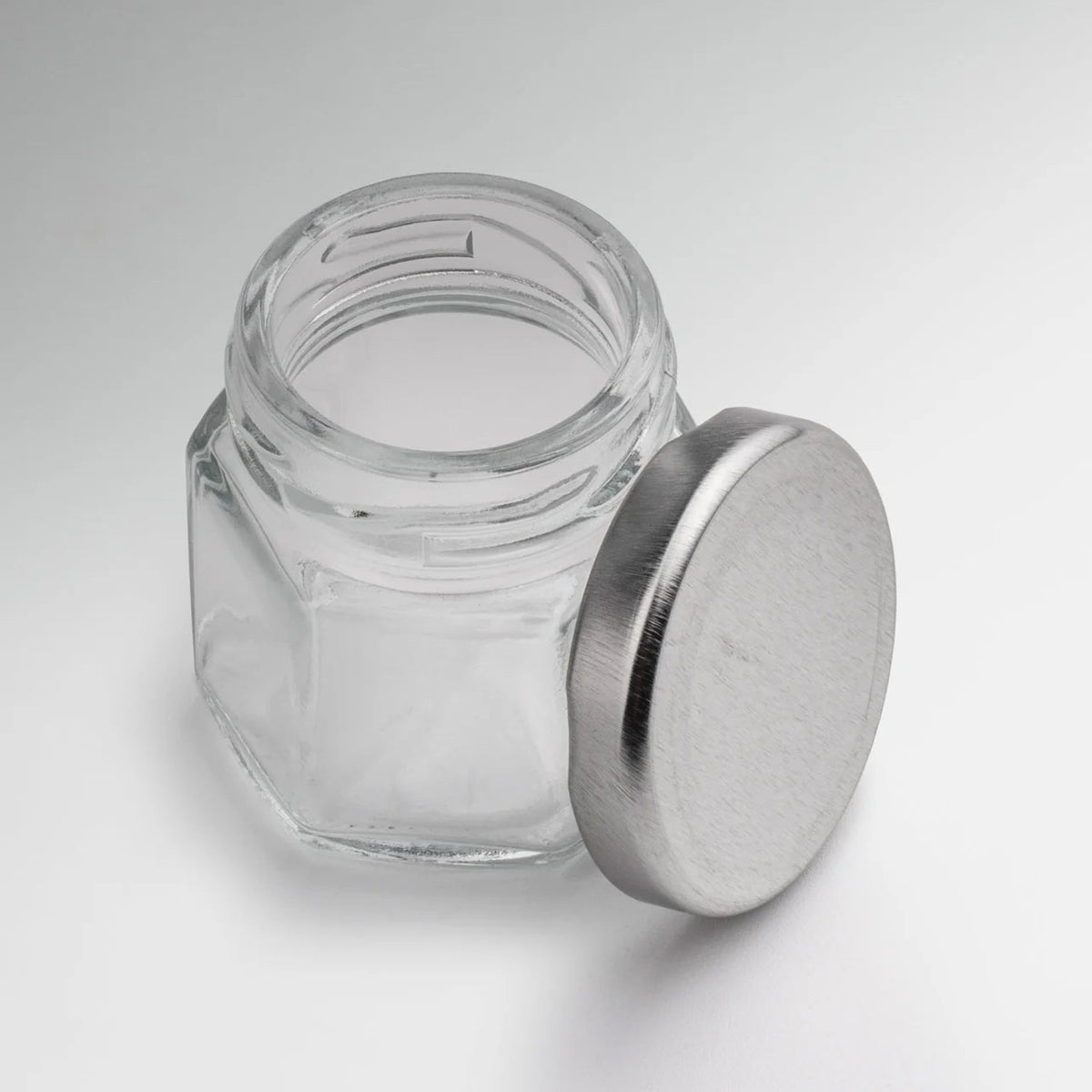 FRASCO VIDRIO HEXAGONAL TAPA PLATA 45ML