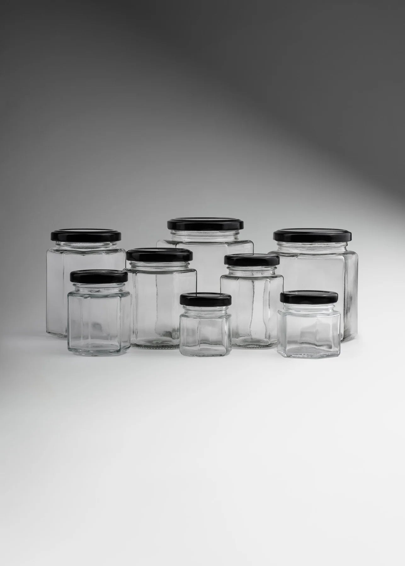 FRASCO VIDRIO HEXAGONAL TAPA NEGRA 280ml