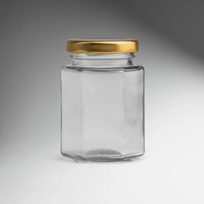 FRASCO VIDRIO HEXAGONAL TAPA DORADA 100ML