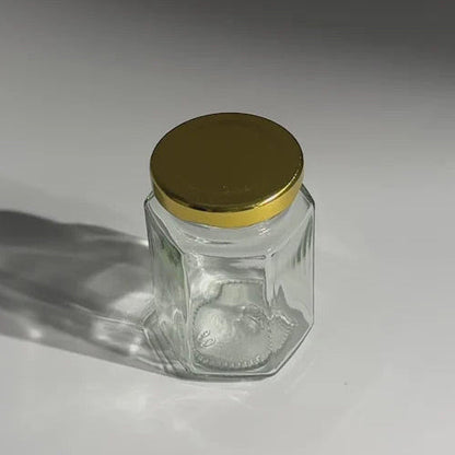FRASCO VIDRIO HEXAGONAL TAPA DORADA 100ML