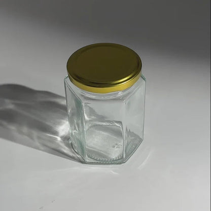 FRASCO VIDRIO HEXAGONAL TAPA DORADA 280ml