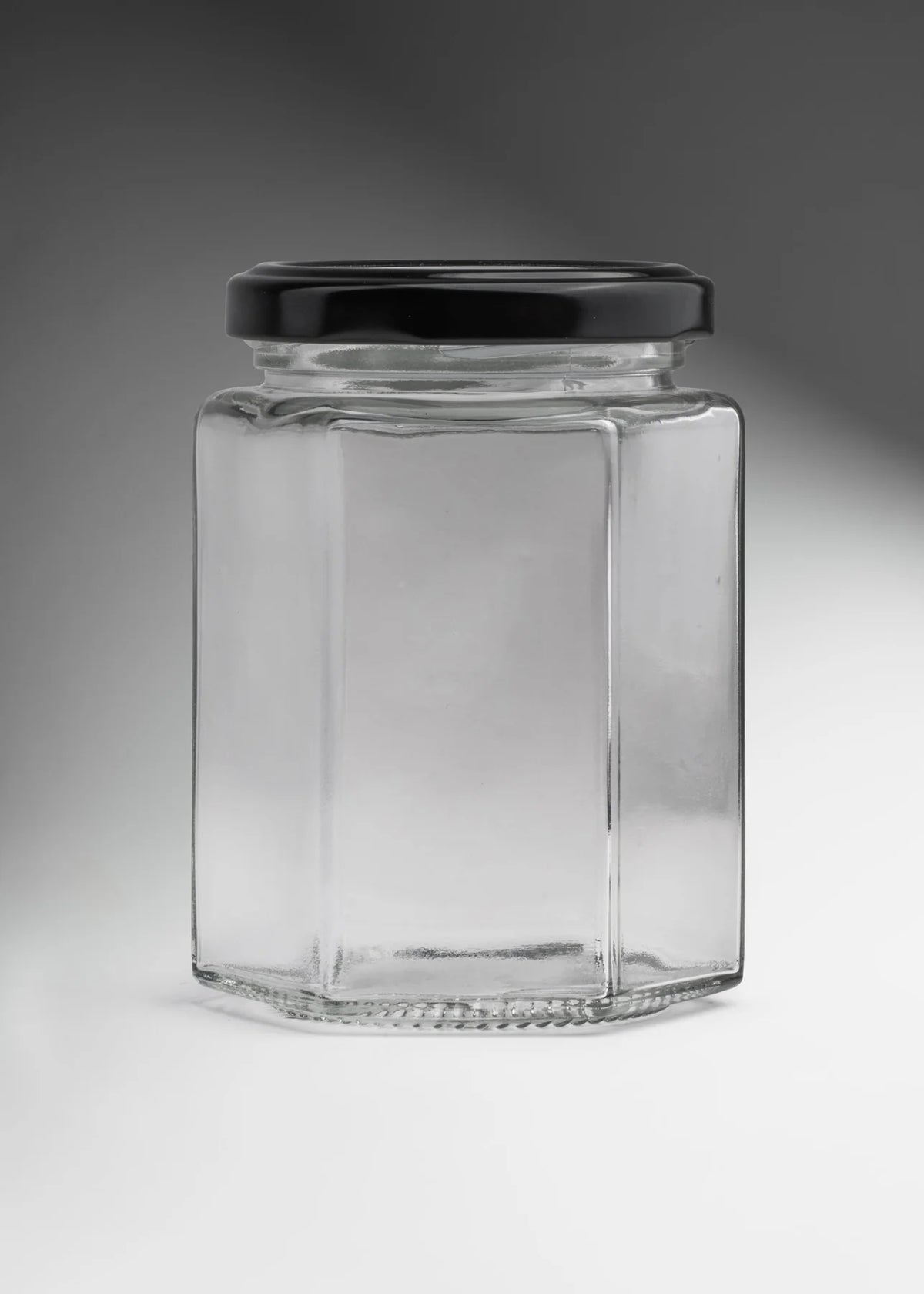 FRASCO VIDRIO HEXAGONAL TAPA NEGRA 280ml