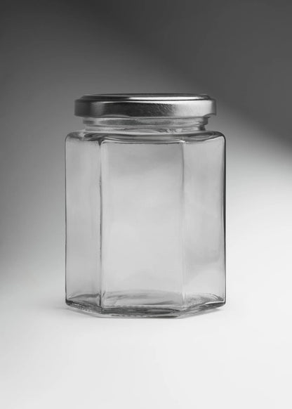 FRASCO VIDRIO HEXAGONAL TAPA PLATA 280ml