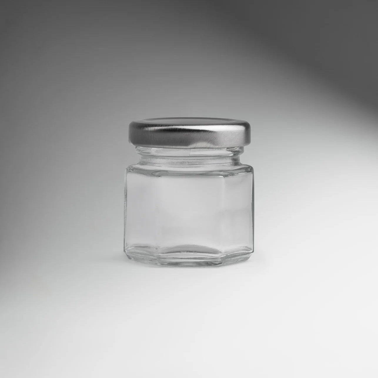 FRASCO VIDRIO HEXAGONAL TAPA PLATA 45ML