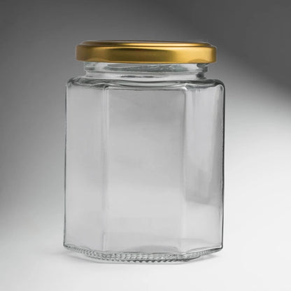 FRASCO VIDRIO HEXAGONAL TAPA DORADA 280ml