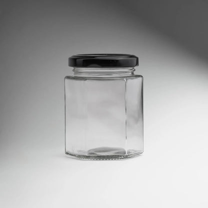 FRASCO VIDRIO HEXAGONAL TAPA NEGRA 100ML